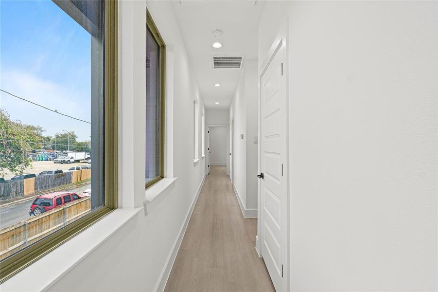 Corridor featuring light hardwood / wood-style floors