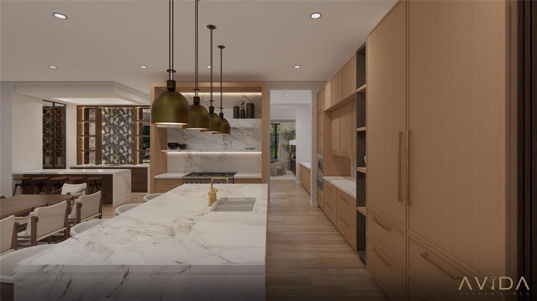 Kitchen with Wood Mode cabinetry and Calcutta Gold marble