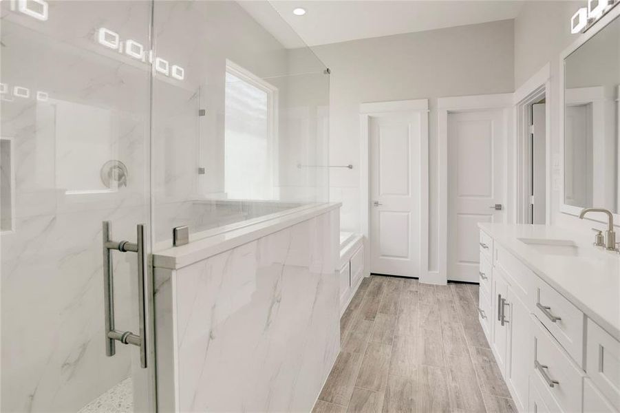 THIS BATHROOM CREATES A SPA-LIKE RETREAT PERFECT FOR RELAXATION AND REJUVENATION.