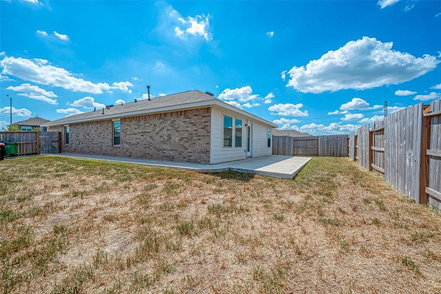 The fully fenced backyard offers plenty of space for entertaining, while also providing a safe area for children and furry friends to play.