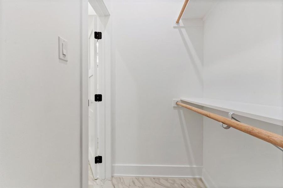 Spacious closet featuring tile patterned floors