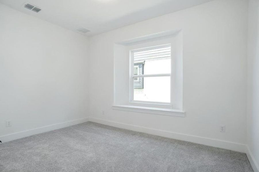 Unfurnished room featuring carpet floors