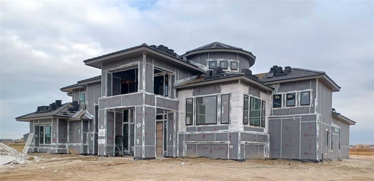 Impressive Grand Villa Vecchio Plan by Fedrick Harris Estate Homes progressing well with stucco soon to come. This phenomenal residence includes 5 Bedrooms, 6.5 Bathrooms, and a 4-car Garage on a corner, cul-de-sac lot and wonderful waterfront view.