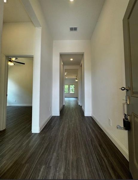 Corridor featuring dark hardwood / wood-style floors