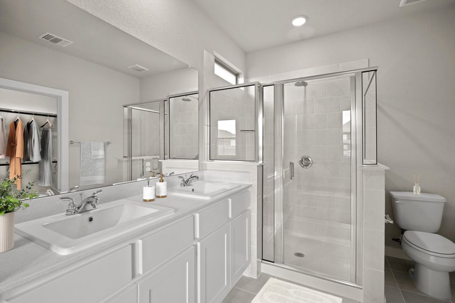 Primary Bathroom in the Birch home plan by Trophy Signature Homes – REPRESENTATIVE PHOTO