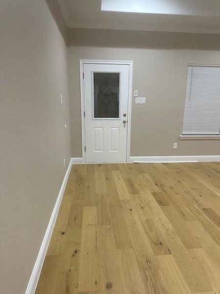 Entrance foyer featuring light hardwood / wood-style flooring