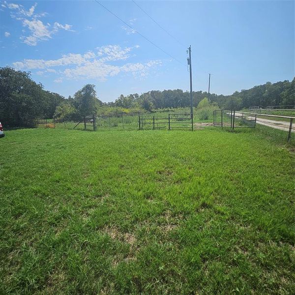 View of yard with a rural view