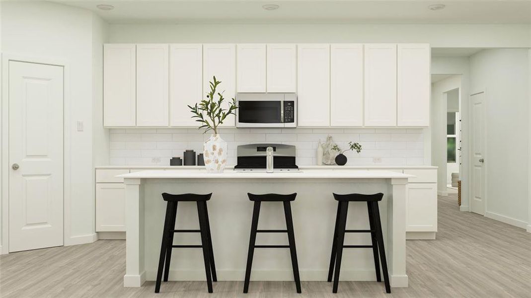 Kitchen with white cabinetry and range