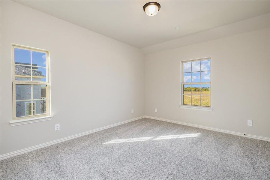 Unfurnished room featuring carpet