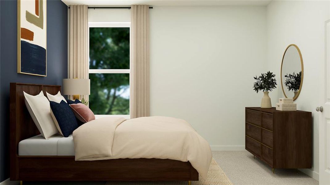 Bedroom featuring light colored carpet