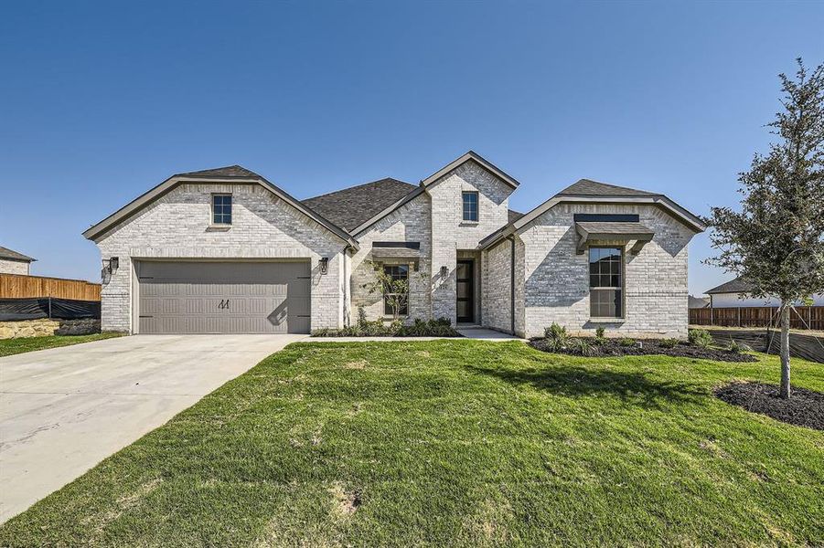 View of front of house with a front lawn