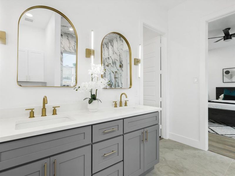 Bathroom featuring double vanity, ceiling fan, and hardwood / wood-style flooring