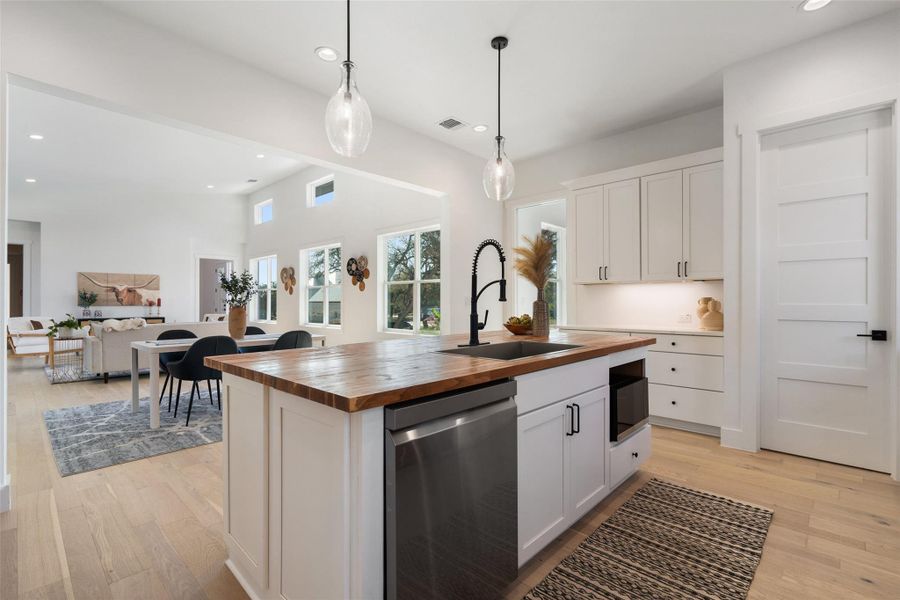 A gourmet kitchen with quartz countertops, stainless steel appliances, and a large island for casual dining and entertaining.