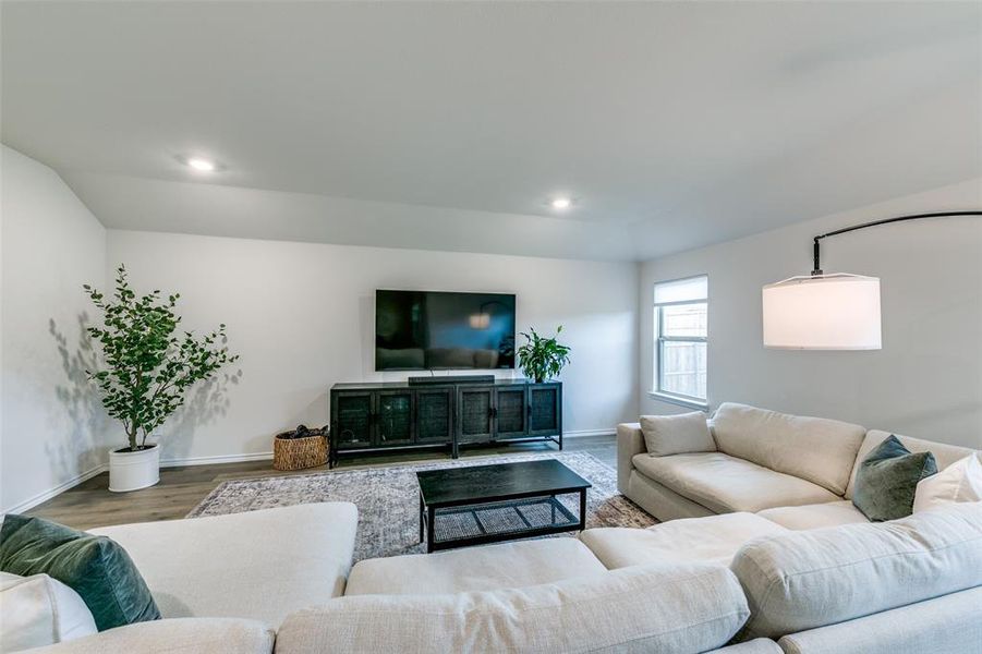 Living room with wood-type flooring