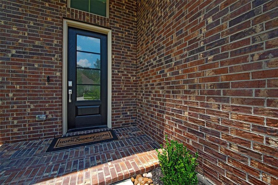 Brick entryway sets the upscale tone.