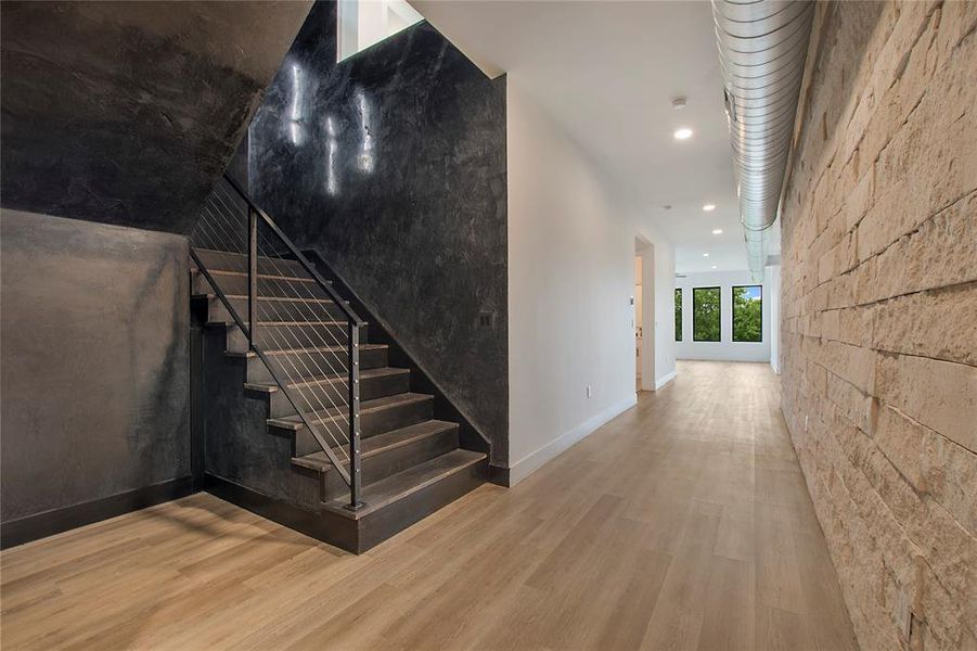 Staircase featuring wood-type flooring