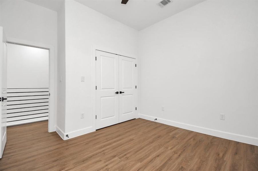 2nd bedroom with double doors and generous closet.