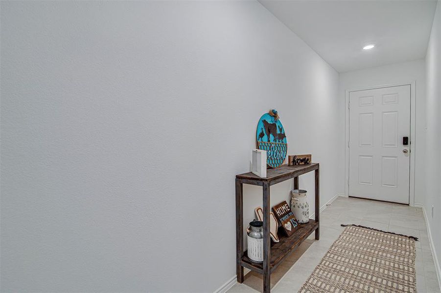 Doorway to outside with light tile patterned floors