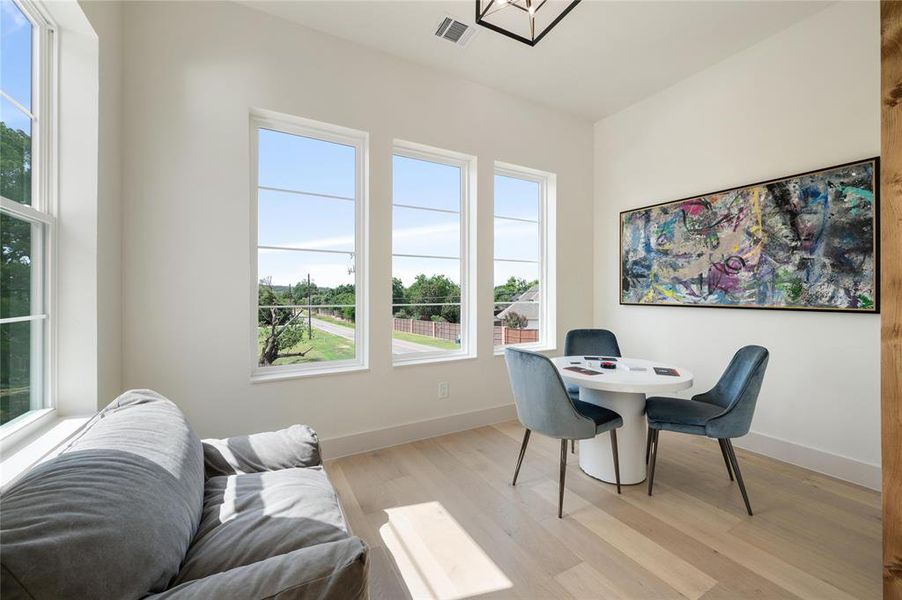 Home office with light wood-type flooring