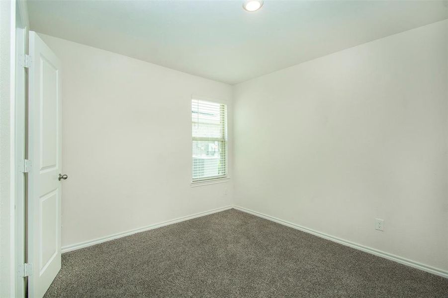 Unfurnished room with carpet