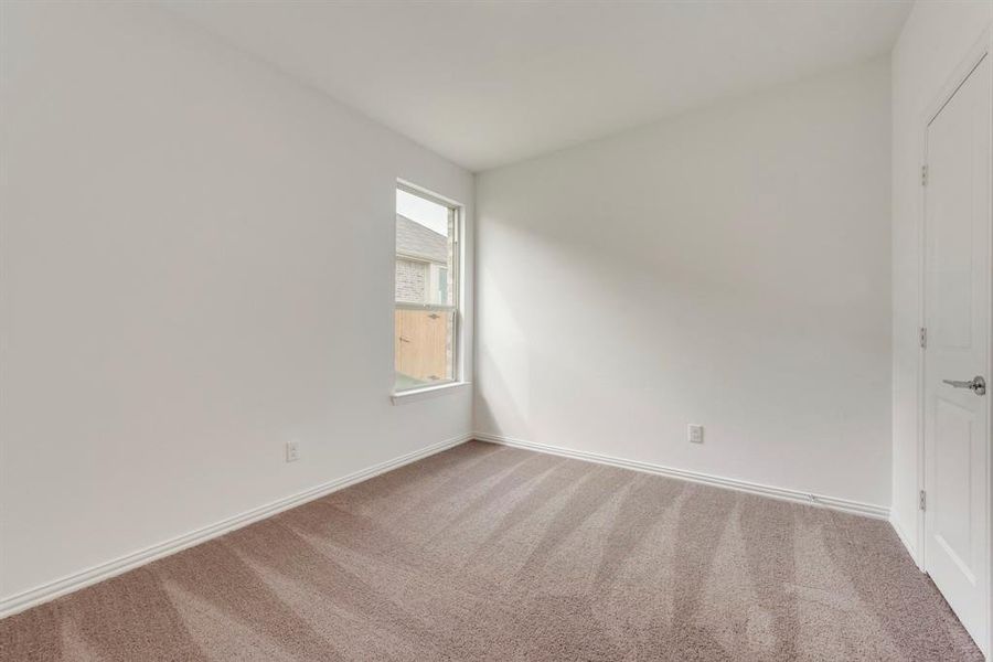 Spare room with carpet floors