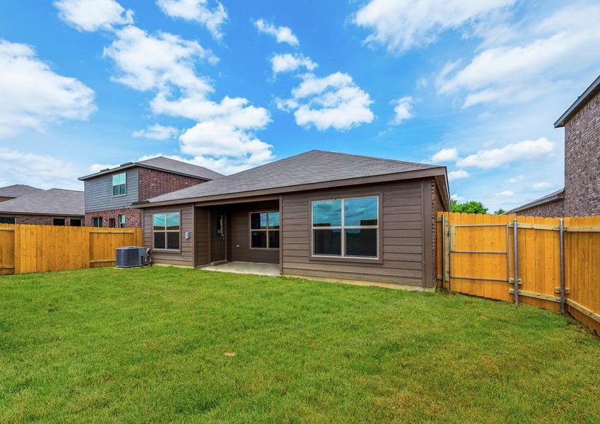 This home has a covered back porch and huge fenced-in backyard.