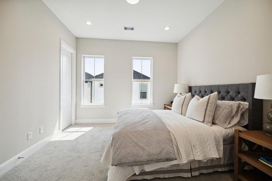 2nd 3rd story bedroom. Large space with lots of natural light.