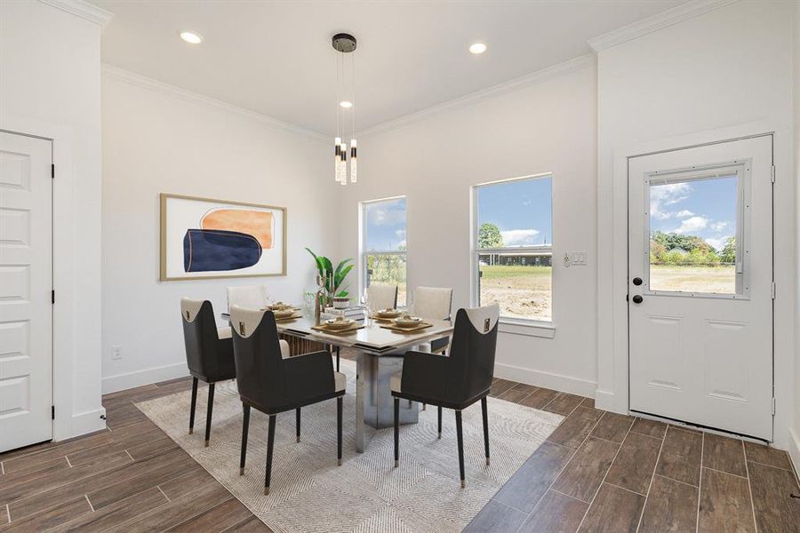 Dining area with ornamental molding and dark wood-type flooring