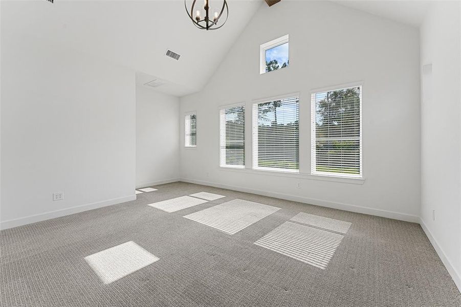 Welcome to your primary bedroom, bathed in beautiful natural light! With ample windows letting in sunshine all day, this room feels bright and airy, creating a peaceful retreat