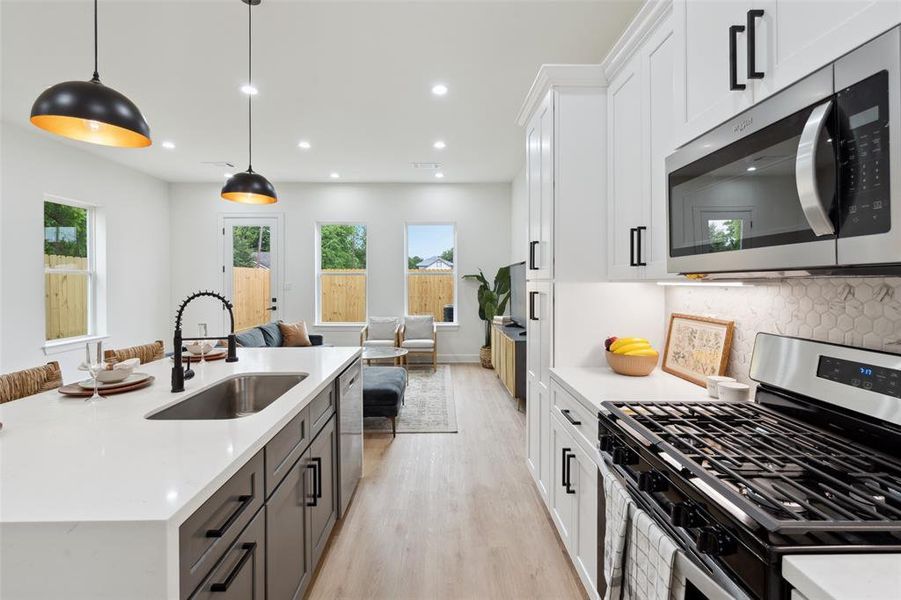 Experience modern convenience in this newly appointed kitchen, boasting brand-new stainless steel appliances that elevate your culinary experience. Glide effortlessly through your culinary creations with soft-close drawers, seamlessly combining practicality with contemporary elegance.