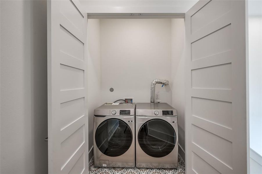 The laundry area is conveniently located on the third floor landing near the bedrooms. Full size washer and dryer are included.