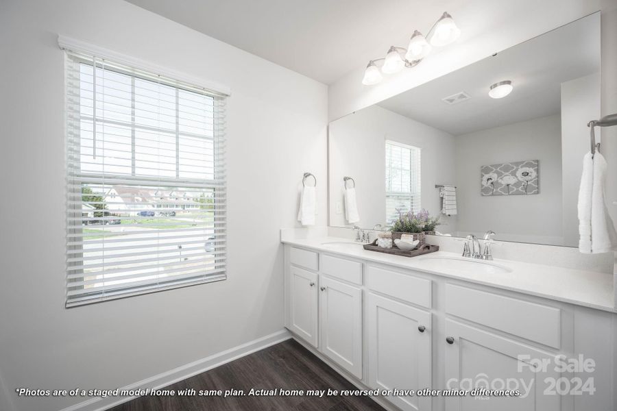 Primary bath with natural light and dual sinks