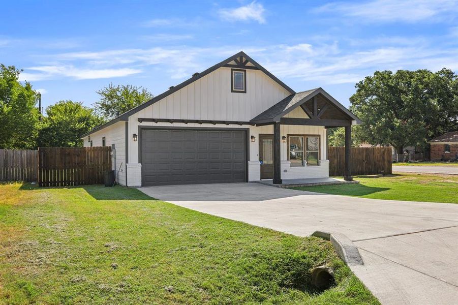 View of front of property with a front yard