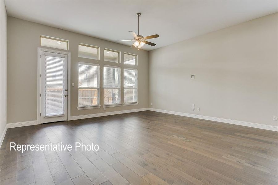 Unfurnished room with hardwood / wood-style flooring and ceiling fan