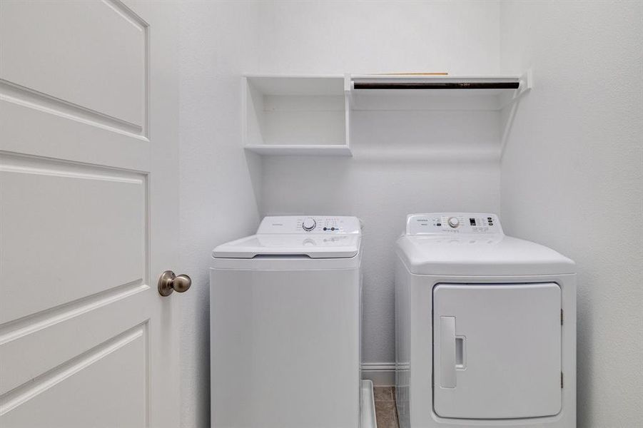 Laundry area with washer and clothes dryer