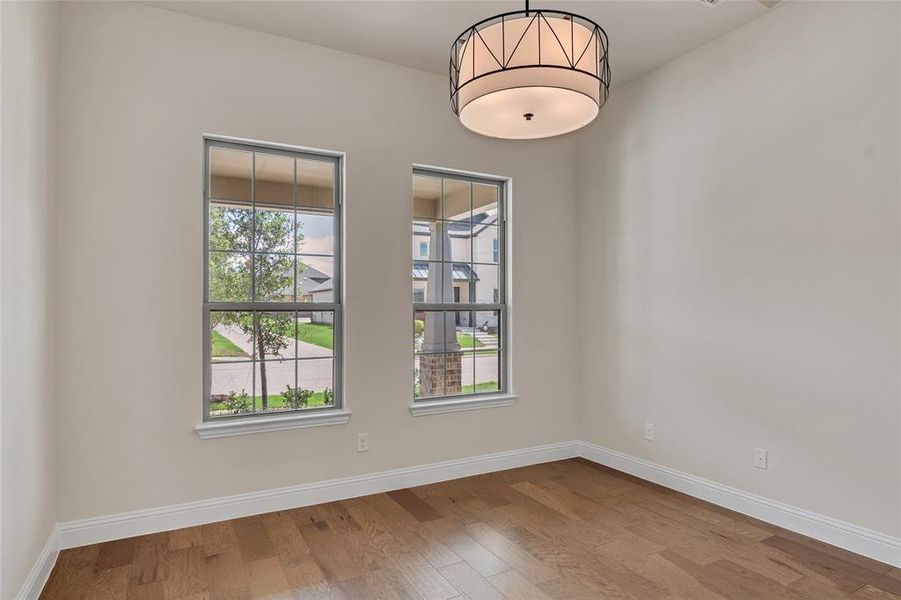 Unfurnished room featuring wood-type flooring