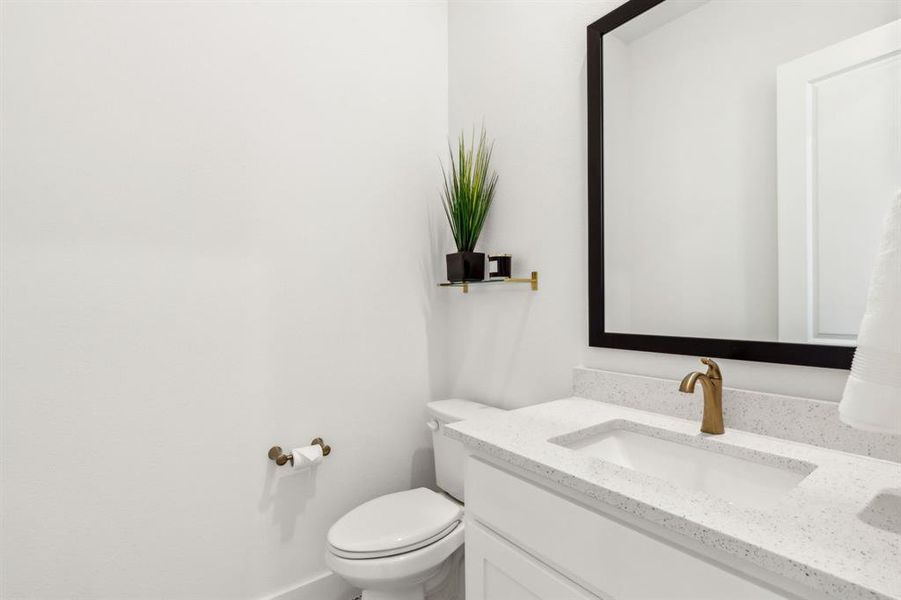 Bathroom featuring vanity and toilet