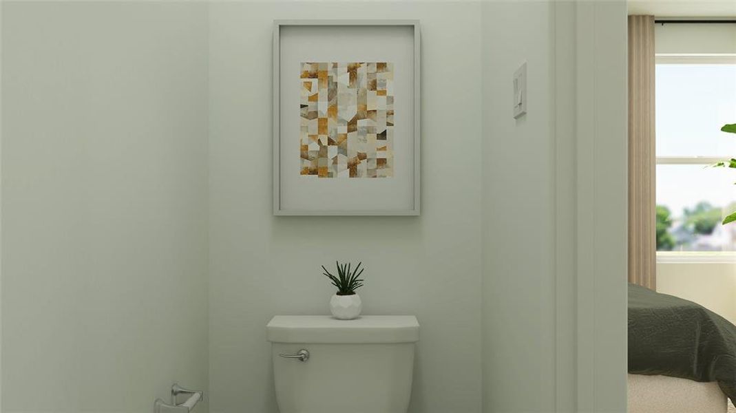 Bathroom featuring toilet and a wealth of natural light