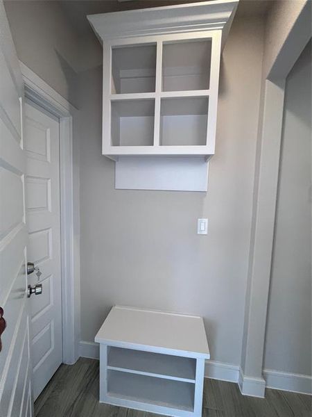 Mudroom with dark hardwood / wood-style floors