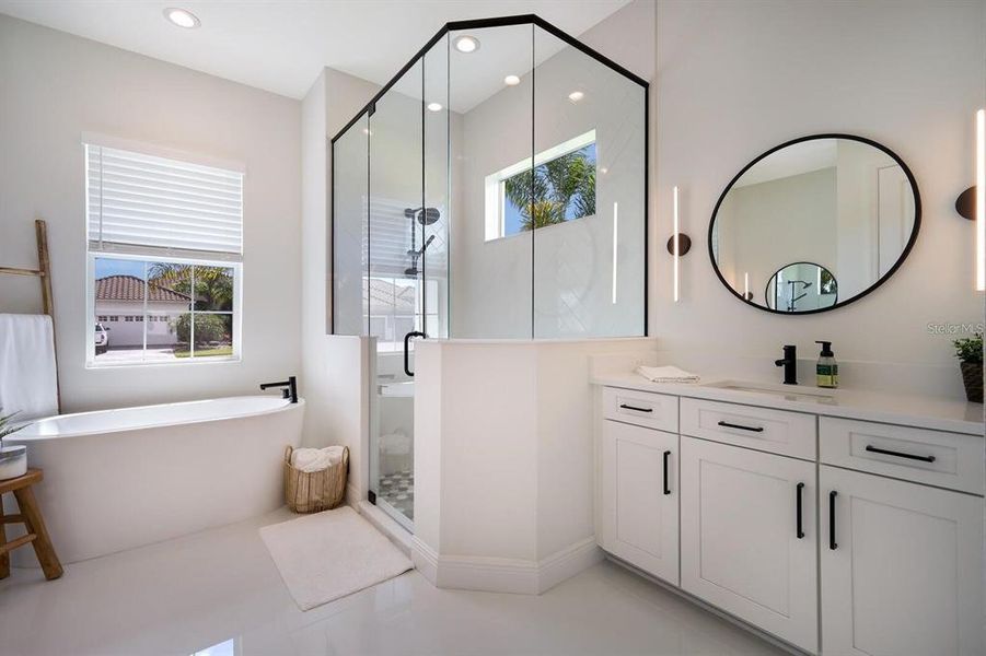 Primary bathroom with full shower and soaking tub