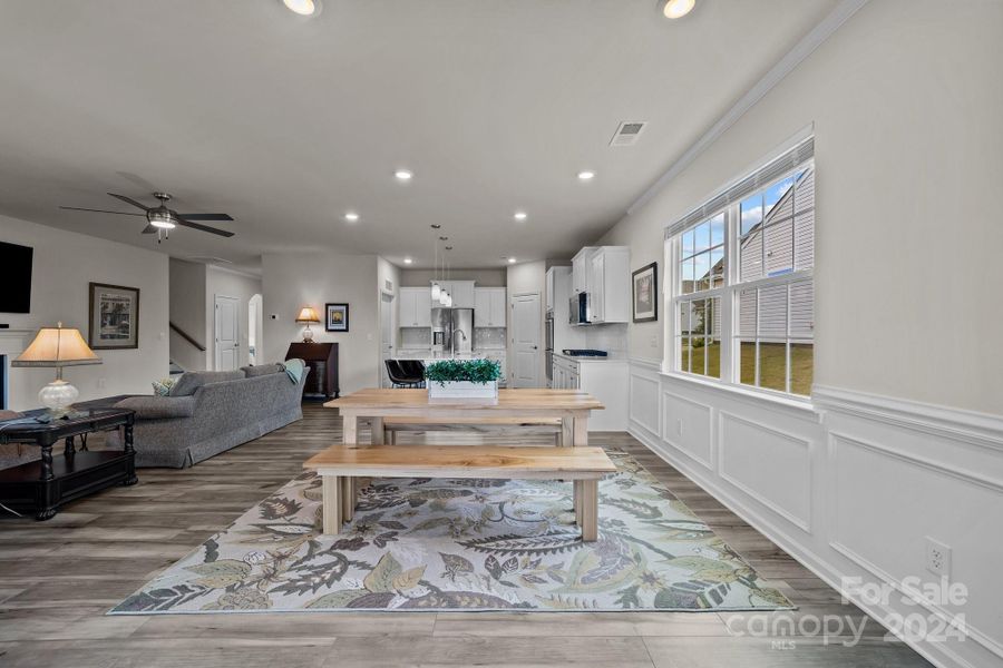 View from the keeping/dining room through to family and kitchen area.  Notice the light throughout this home!