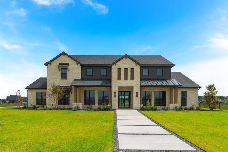 View of front of house with a front yard