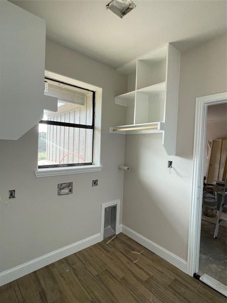 Laundry room with hookup for an electric dryer, dark wood-type flooring, and washer hookup