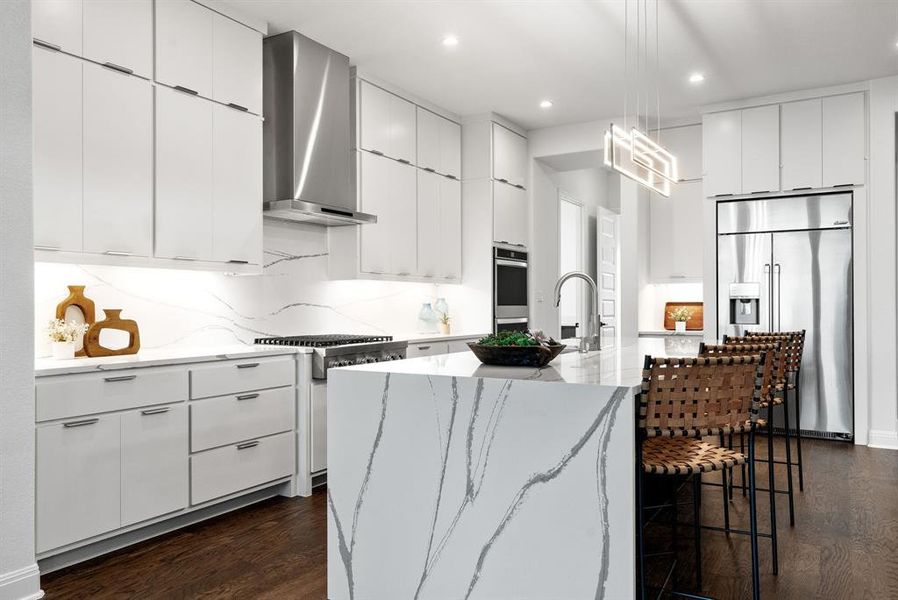 The kitchen is a chefs dream featuring lots of cabinet space and beautiful finishes