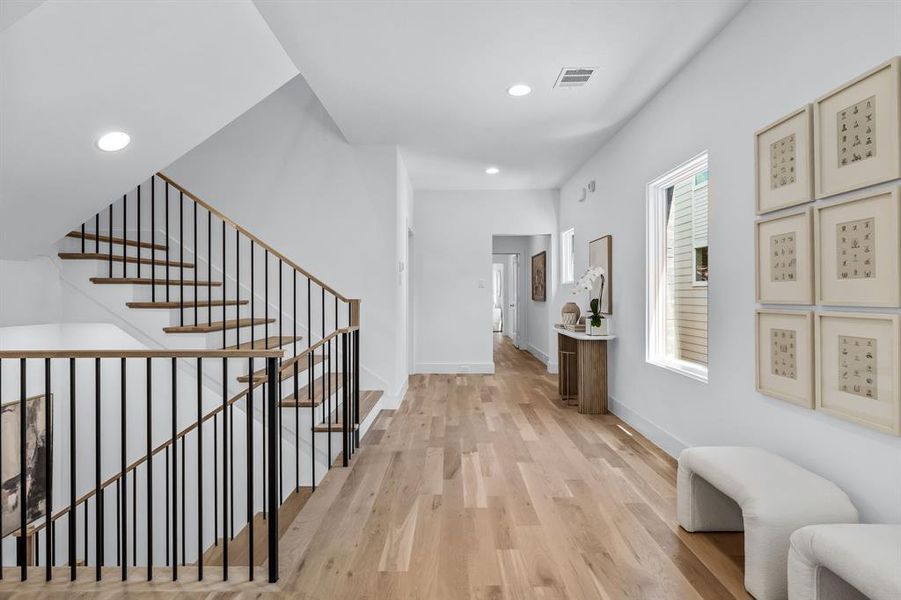 Corridor featuring light hardwood / wood-style floors