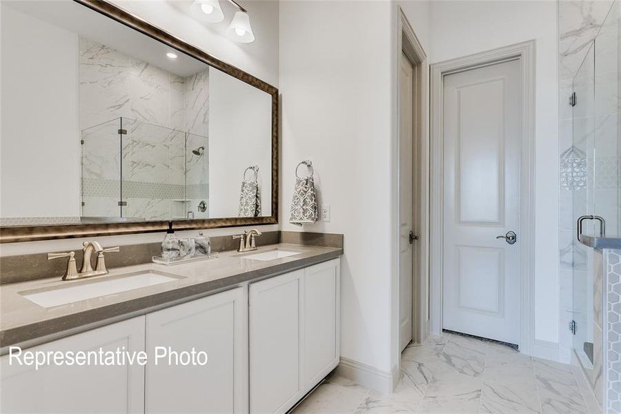 Bathroom with walk in shower, tile flooring, oversized vanity, and dual sinks