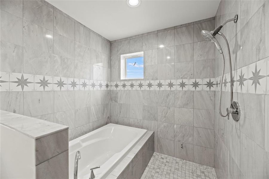 The design is all the way.  Deep soaking tub with separate large open shower.