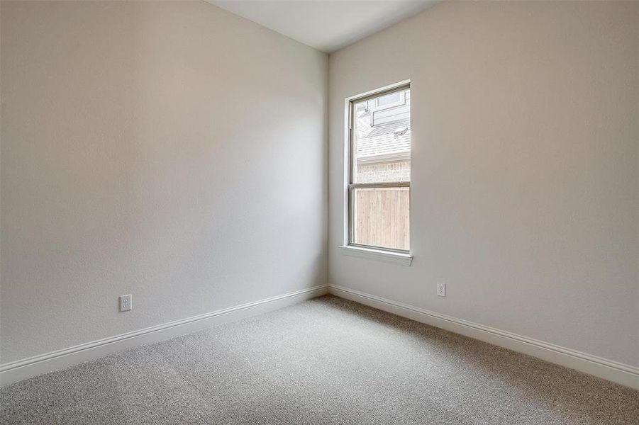 Empty room with carpet flooring