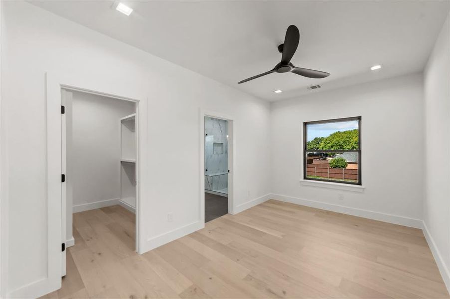 Third Bedroom on 2nd Floor featuring light wood-type flooring, a spacious closet, ceiling fan, and ensuite bathroom