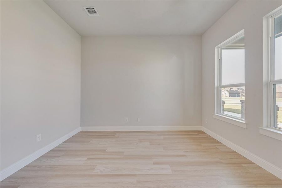 Spare room with light hardwood / wood-style floors